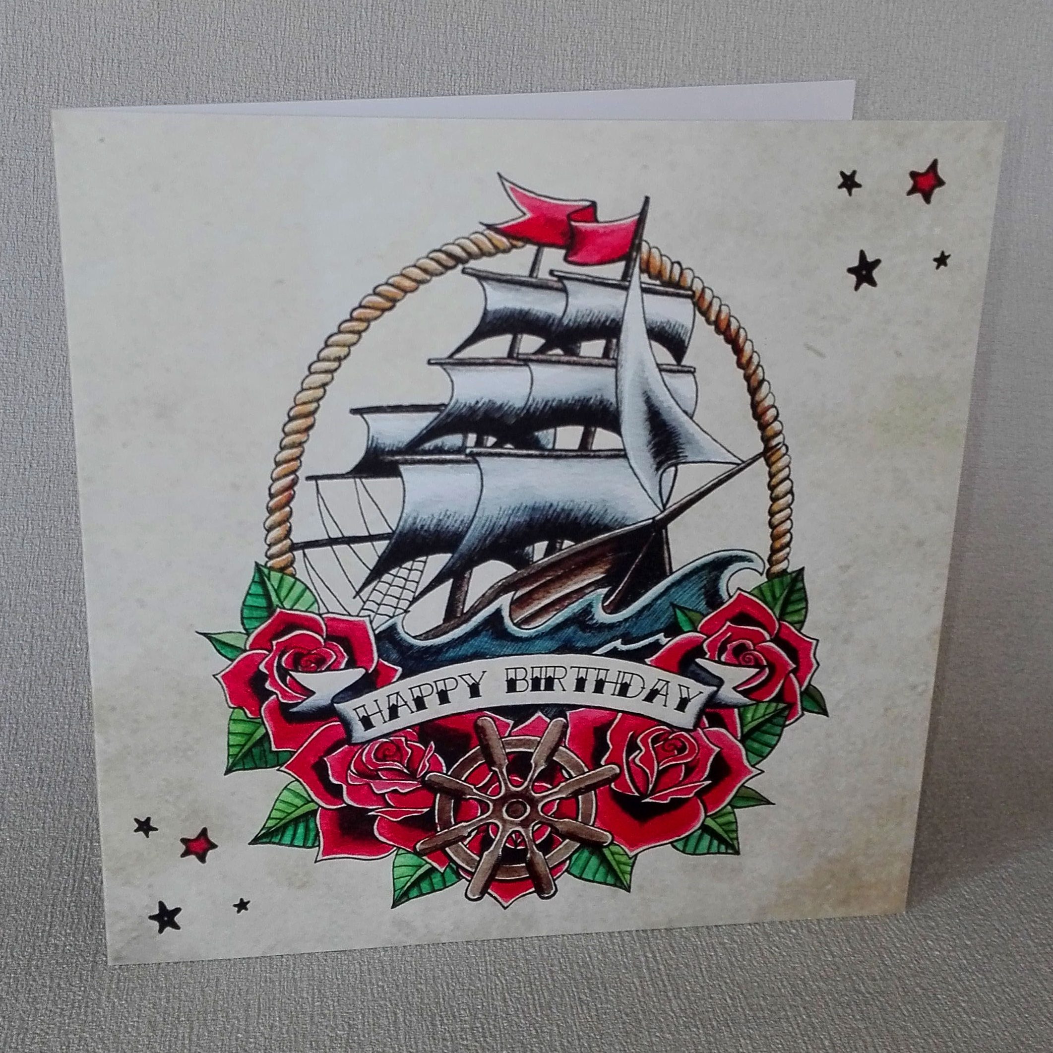 Micro-realistic sailing ship tattoo on the inner arm